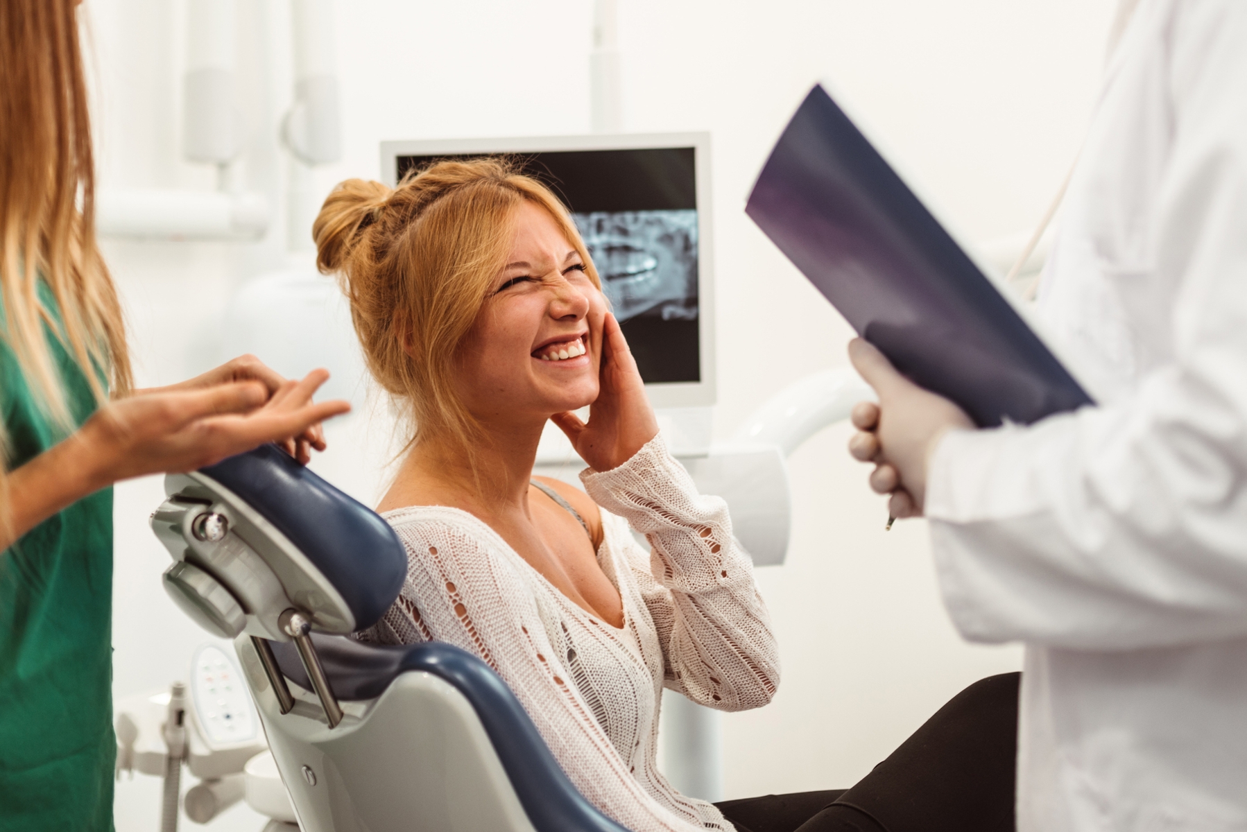 Patient speaking with a dental team about managing dental anxiety