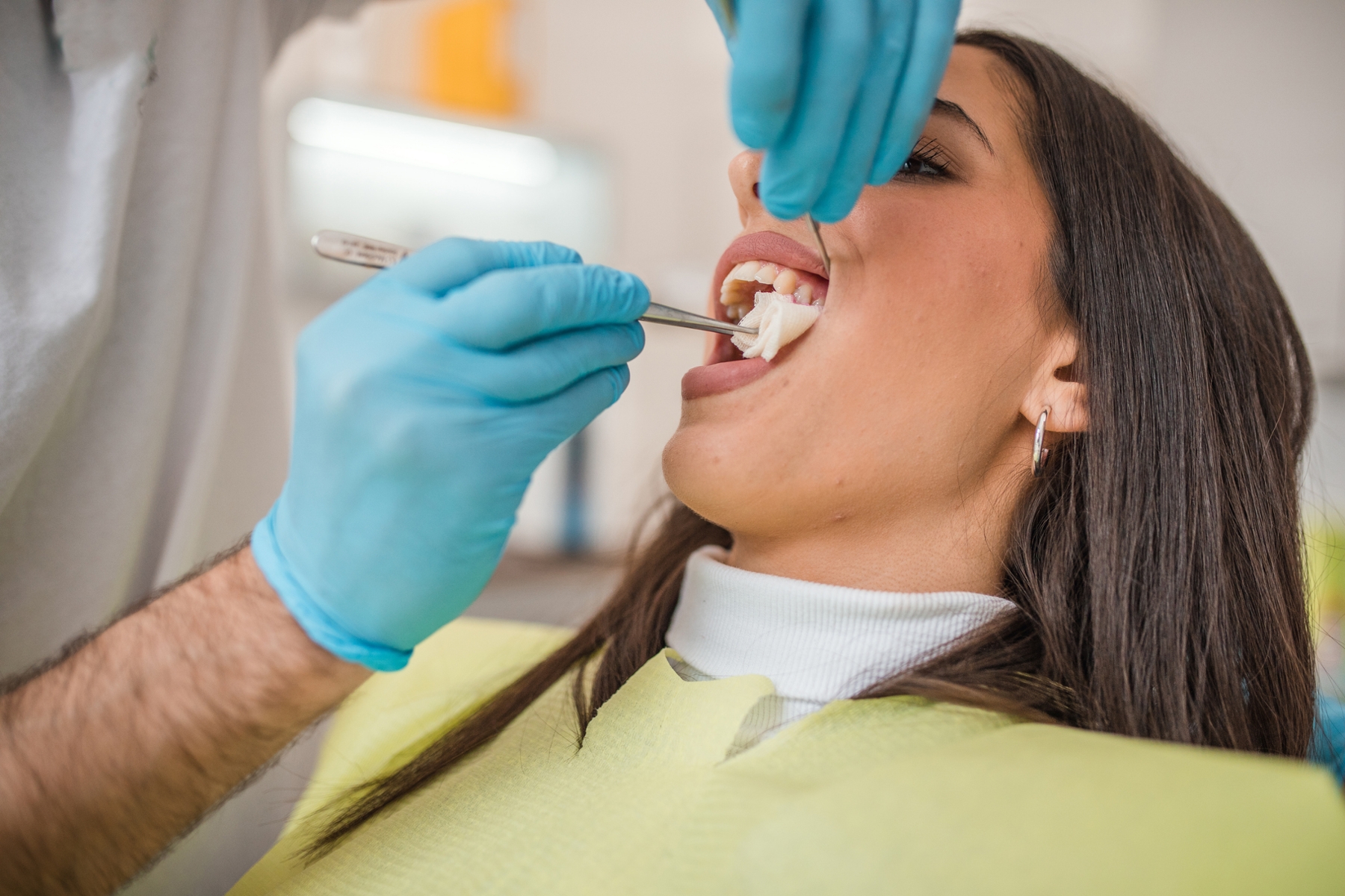 Patient undergoing a tooth extraction procedure at a dental office