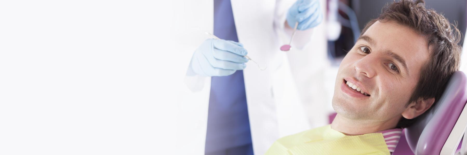 Man smiling during dental examination in High Point, NC