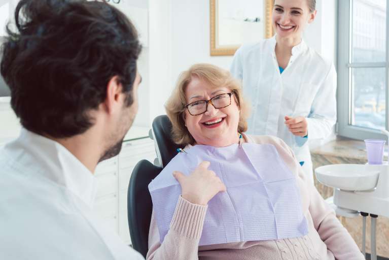 patient discussing her gum disease treatment options in high point