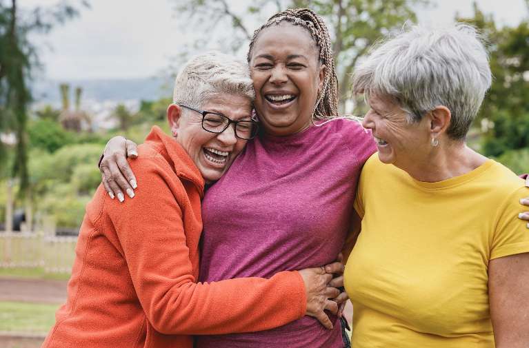 friends smiling when discussing dental implants in high point