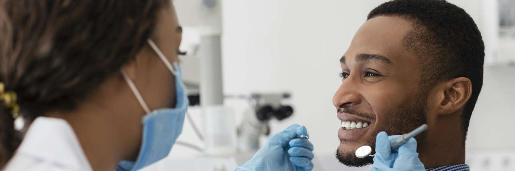 man at dentist to replace missing teeth high point